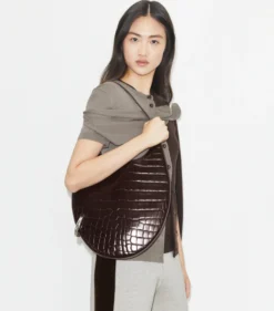 TASCHE MIT PIERCINGDETAIL UND KROKODILPRÄGUNG